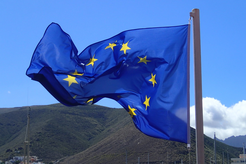 European Union flag in Brussels amid EU AI Act compliance audits