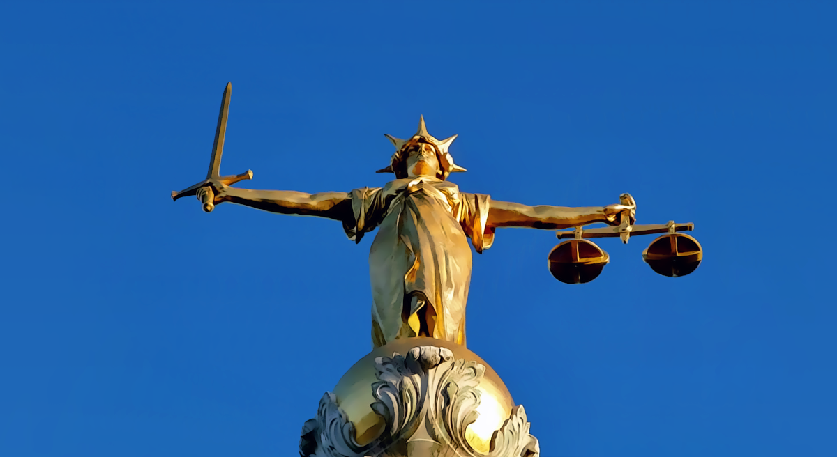 Statue of Lady Justice symbolizing the Apple OpenAI trial date set for July 2027