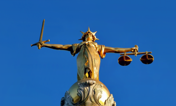 Statue of Lady Justice symbolizing the Apple OpenAI trial date set for July 2027