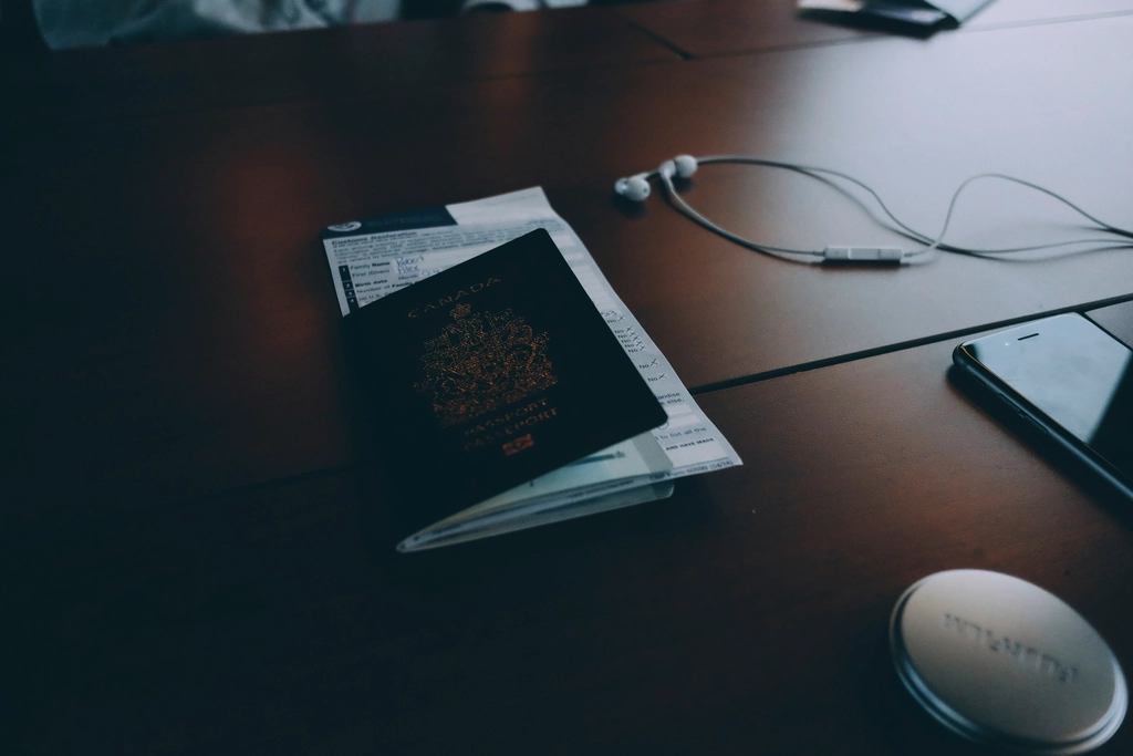 A desk with forms reflecting Canada work permit processing updates