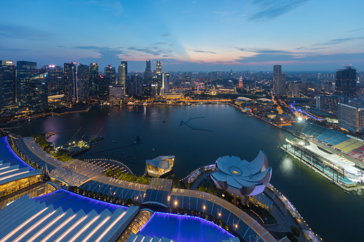 Singapore skyline at dusk, where the Singapore work pass changes take effect October 29