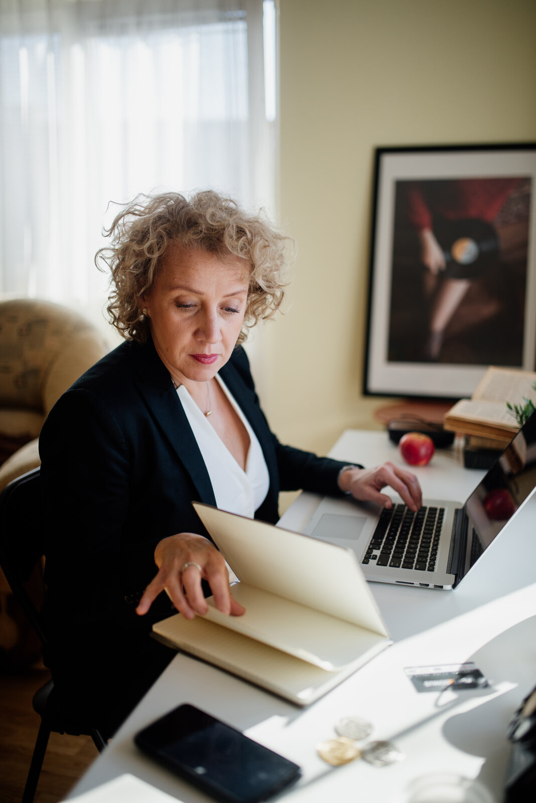 A professional filing documents online, relevant to the Singapore work pass changes